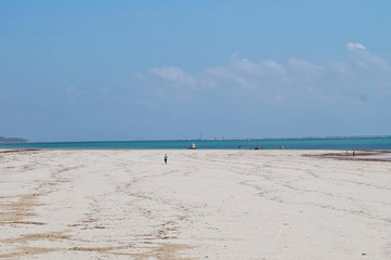 empty white beach blue sky