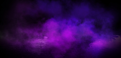 Dark street, night view, ultraviolet neon light. Light rays reflected on wet pavement. Smoke, could. Empty street scene. Neon light.