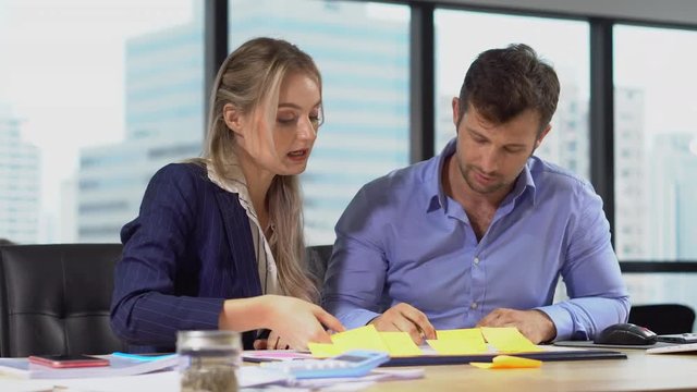 Group of  business people men and woman working together with paper document file or Memo notes or post it   in meeting room.teamwork discussing in office , talking , debate , analyze , select