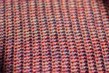 Multicolored knittwear background in soft light