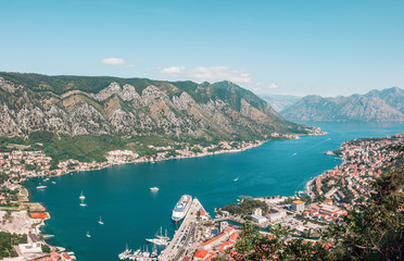Obraz premium Cityscape of old city Kotor, bay in Adriatic sea surrounded by mountains, Montenegro. Panoramic view from above
