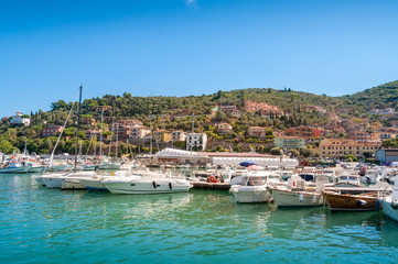 Fototapeta na wymiar Beautiful Italian town view with yachts moored at the bay