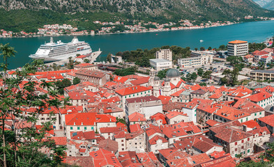Naklejka na ściany i meble Cityscape of old city Kotor, bay in Adriatic sea surrounded by mountains, Montenegro. Panoramic view from above