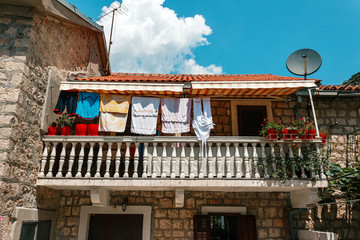 Balcony with clothing in the old stone house in Kotor town, Montenegro
