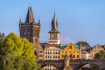 Fototapeta premium Prague cityscape with historic landmark of Charles Bridge with crowd of people