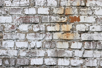 Old wall made of red brick, painted white in loft style for modern designer interior of room, bar or restaurant