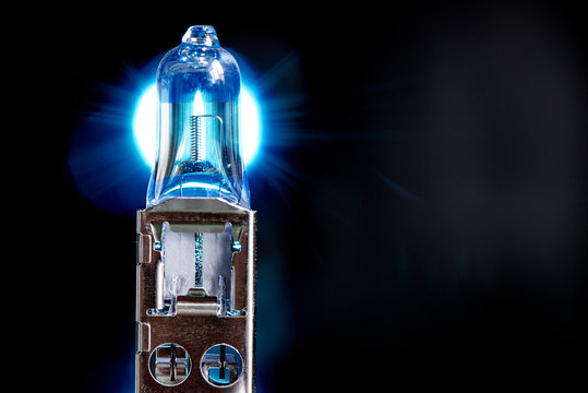 Spare light bulb for a car's headlights on black background.Сopy space.