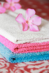 Obraz na płótnie Canvas multi-colored cotton white blue pink bath towels for the bathroom