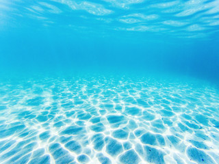 Fototapeta na wymiar tropical blue ocean underwater background - luxury nature pattern