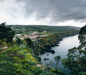 Fototapeta na wymiar North coast Landscape over Capelas town on Sao Miguel island, Azores archipelago, Portugal. Miradouro do Porto das Capelas.