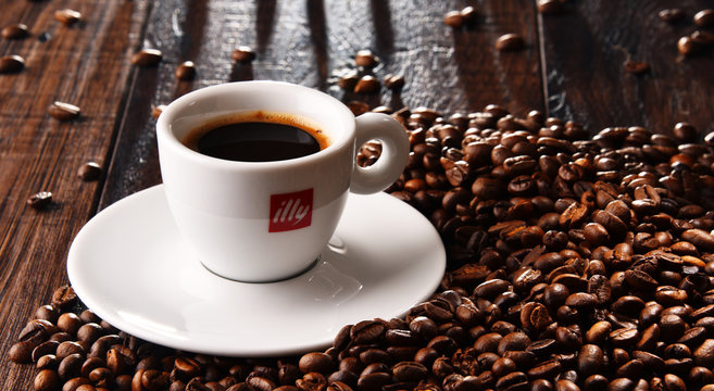 Composition with cup of Illy coffee and beans