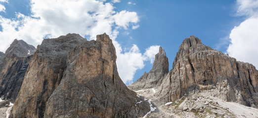 Fototapeta na wymiar Panoramic view of Catinaccio mountain and Vajolet Towers on the way to Passo Santner. Dolomites, Italy