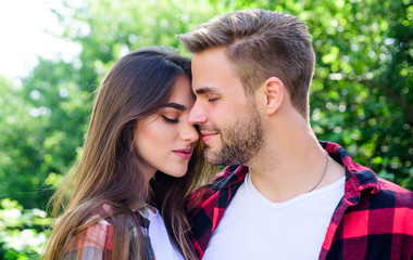 Fototapeta premium Doing everything together. hipster couple outdoor. man and woman in checkered shirt relax in park. valentines day. summer camping in forest. family weekend. romantic date. couple in love. Hiking