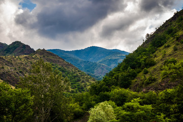 Mountain and forest, cloudy day with dark clouds. Near the Ibar river and Maglic castle in Serbia