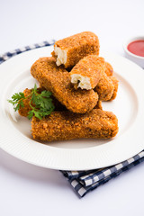Kurkuri paneer fingers or pakora/pakoda snacks also known as Crispy Cottage Cheese Bars, served with tomato ketchup as a starter. selective focus