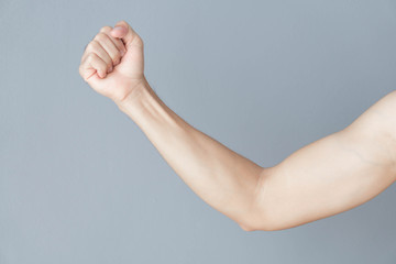 Back arm muscle man with grey background, health care and medical concept