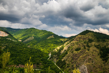 Mountain and forest, cloudy day with dark clouds. Near the Ibar river and Maglic castle in Serbia