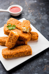 Kurkuri paneer fingers or pakora/pakoda snacks also known as Crispy Cottage Cheese Bars, served...