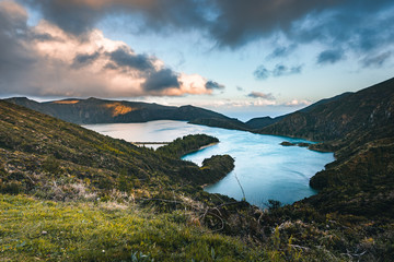 Naklejka na ściany i meble Beautiful panoramic view of Lagoa do Fogo, Lake of Fire, in Sao Miguel Island, Azores, Portugal. Sunny day with blue sky and clouds.