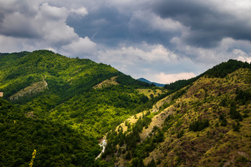 Mountain and forest, cloudy day with dark clouds. Near the Ibar river and Maglic castle in Serbia