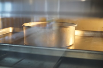 Close up Baking Birthday cake in oven.