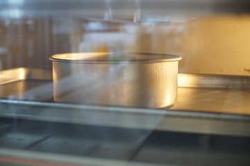 Close up Baking Birthday cake in oven.