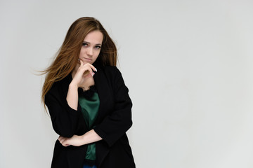 Concept portrait for the waist of a pretty girl, a young woman with long beautiful brown hair and a...