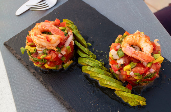 Cret, Greece.June 2019. A prawn ,avacodo and chopped salad starter served on slate