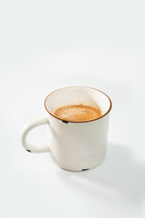 coffee cup in the morning light on white background