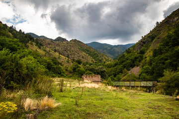 Naklejka premium Mountain and forest, cloudy day with dark clouds. Near the Ibar river and Maglic castle in Serbia