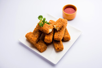 Kurkuri paneer fingers or pakora/pakoda snacks also known as Crispy Cottage Cheese Bars, served with tomato ketchup as a starter. selective focus