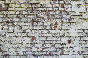 Brick wall grunge background. Texture of vintage bricks. Old rough brickwork. Pattern. Space texture. Wall in white paint, whitewash.