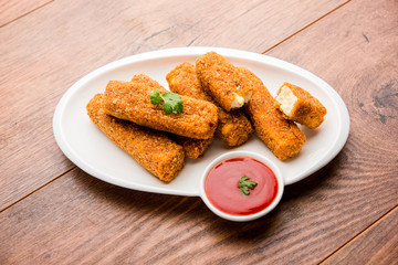 Kurkuri paneer fingers or pakora/pakoda snacks also known as Crispy Cottage Cheese Bars, served with tomato ketchup as a starter. selective focus