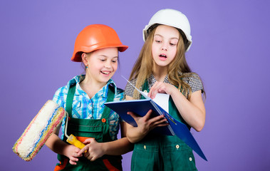 Kids choosing paint colour for their new room. Children sisters run renovation their room. Amateur renovation. Sisters renovating home. Home improvement activities. Kids girls planning renovation