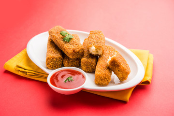 Kurkuri paneer fingers or pakora/pakoda snacks also known as Crispy Cottage Cheese Bars, served with tomato ketchup as a starter. selective focus