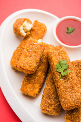 Kurkuri paneer fingers or pakora/pakoda snacks also known as Crispy Cottage Cheese Bars, served with tomato ketchup as a starter. selective focus