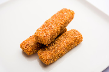 Kurkuri paneer fingers or pakora/pakoda snacks also known as Crispy Cottage Cheese Bars, served with tomato ketchup as a starter. selective focus