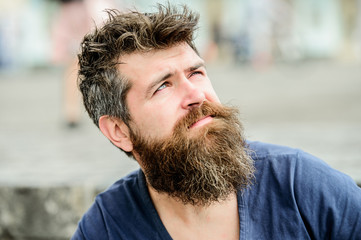 Fototapeta premium Thinking and hesitating. Bearded man concentrated face. Thoughtful mood concept. Making important choices. Man with beard and mustache thoughtful troubled. Hipster with beard thoughtful expression