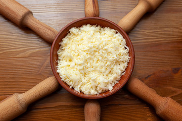 Grated cheese and rolling pins on the table