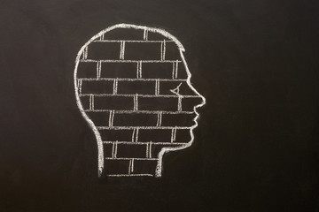 Human head with brick wall. Mental block. Symbolized with a brick wall in the brain of a person.