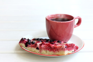 sweet pastry with berries and a cup of coffee. dessert with hot drink