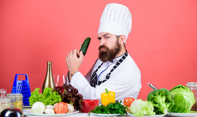 Food alternative. Dieting and organic food, vitamin. Chef man in hat. Secret taste recipe. Bearded man cook in kitchen, culinary. Healthy food cooking. Vegetarian. Mature chef with beard