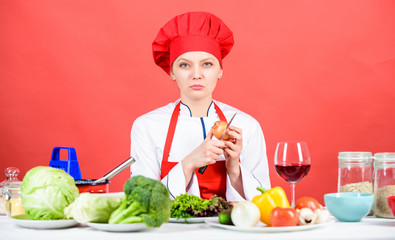 Suffer but keep doing. Housewife cook crying while cutting onion. Slice and chop onion. Stinging eyes and tears cutting onions. Chef cook peeling onion. Kitchen routine. Girl cooking healthy meal