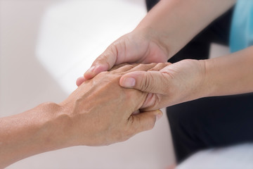 Love concept; top view arms stretched out and holds one another, joint support and assistance in the community. The helping hands for elderly home care