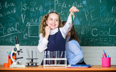 students doing biology experiments with microscope in lab. Happy children. Biology lesson. biology...