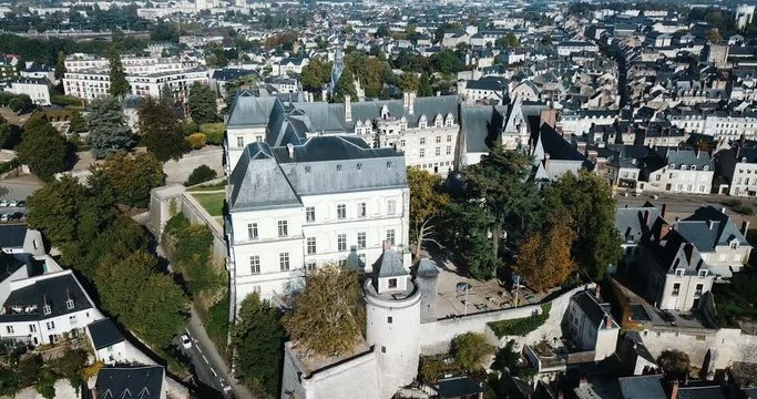 BLOIS, FRANCE - OCTOBER 09, 2018: View from drone of impressive Royal Chateau de Blois on background with cityscape in sunny autumn day, France