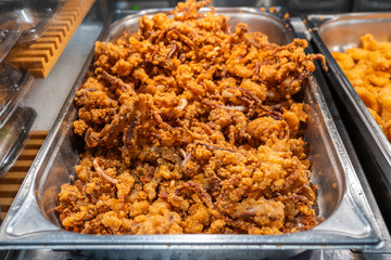 Fried seafood with batter for sale at food market