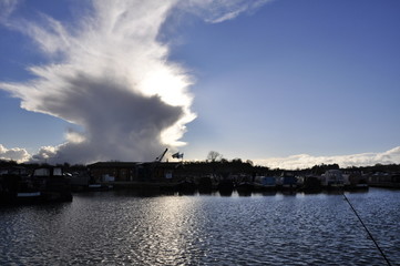 Naklejka na ściany i meble winter storm cloud over water