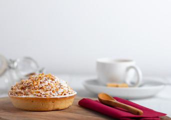 homemade cake with whipped cream and crushed nuts