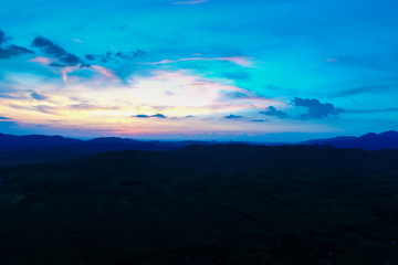 Fototapeta na wymiar Amazing silhouette mountain sunset with colorful sky nature background
